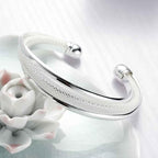 Ezüstös csavart karperec